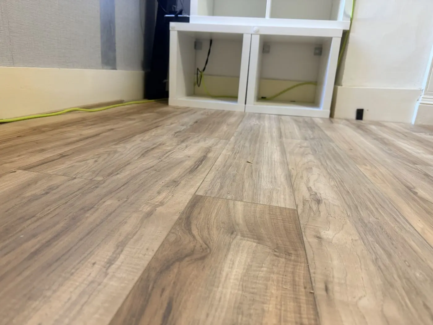 The same room with new laminate flooring laid and finished