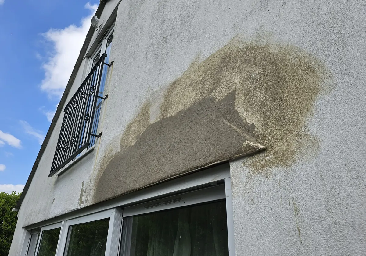 Fresh render applied to an external wall, drying before painting